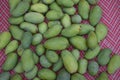 Fresh green raw mangoes heap. View from above. Popular fruit in Pakistan. Royalty Free Stock Photo