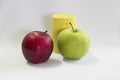 Fresh green,red apple and cup yellow. Royalty Free Stock Photo