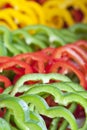 Fresh green red and yellow peppers