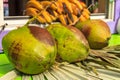 Fresh green ripe coconuts ready to be cracked open for coconut w Royalty Free Stock Photo