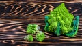 Fresh green Romanesco broccoli on a wooden board, rustic wooden background - healthy or vegetarian food concept. Low-calorie Royalty Free Stock Photo