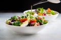 Fresh green salad with cherry tomato mozzarella and olives Royalty Free Stock Photo