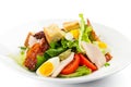 Fresh green salad with chicken, bacon, eggs, tomatoes and croutons Royalty Free Stock Photo