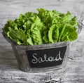 Fresh green salad in a vintage bucket Royalty Free Stock Photo
