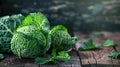 Fresh green savoy cabbage on rustic wooden background