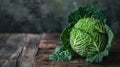 Fresh green savoy cabbage on rustic wooden background