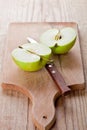 Fresh green sliced apple and knife Royalty Free Stock Photo