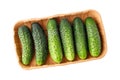 Fresh green small cucumbers gherkin on recycled paper tray. Zero waste supermarket packaging Royalty Free Stock Photo