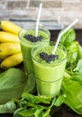 Fresh green smoothie with banana and spinach with heart of sesame seeds. Love for a healthy raw food concept. Royalty Free Stock Photo