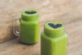 Fresh green smoothie with banana and spinach with heart of sesame seeds. Love for a healthy raw food concept Royalty Free Stock Photo