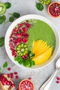 Fresh green smoothie bowl with fruits and berries Royalty Free Stock Photo