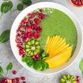Fresh green smoothie bowl with fruits and berries Royalty Free Stock Photo