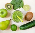 Fresh green smoothie in the glass and fruits and vegetables Royalty Free Stock Photo