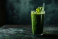 Fresh green smoothie in a glass with a straw Royalty Free Stock Photo