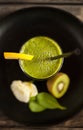 Fresh green smoothie on the plate - Top view Royalty Free Stock Photo