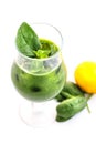 Fresh green smoothie with spinach leaf and lemon in glass isolated on white background, spinach, cucumber, apple fruit drink, prod Royalty Free Stock Photo