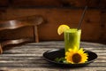 Fresh green smoothie on wooden table Royalty Free Stock Photo