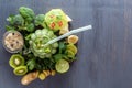 Fresh green smoothies with vegetables, fruits and oatmeal in a glass cup on a black wooden table Royalty Free Stock Photo