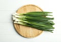 Fresh green spring onions on white table, top view Royalty Free Stock Photo