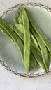 Fresh green string beans in a bowl on a marble table Royalty Free Stock Photo