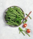 fresh green string beans in a gray plate top view Royalty Free Stock Photo