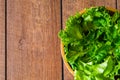 Fresh green vegetable leaves mix. Healthy food salad, Top view from above of spinach, lettuce in wooden bowl on wood table backgro Royalty Free Stock Photo