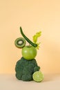 Fresh green vegetables and fruits balancing on the table. Equilibrium floating food balance Royalty Free Stock Photo