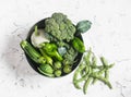 Fresh green vegetables in metal basket - zucchini, squash, cucumbers, peppers, tomatoes, broccoli, green beans Royalty Free Stock Photo