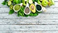 Fresh green vegetables in a rustic white background. Avocado, kiwi, onion, lime, parsley. Organic food. Rustic style. Royalty Free Stock Photo