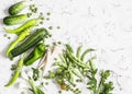 Fresh green vegetables - zucchini, cucumbers, green peas and beans, parsnips, peppers, tomatoes, onions on a white background. Royalty Free Stock Photo