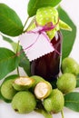 Fresh green walnuts and liqueur Royalty Free Stock Photo