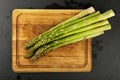 Fresh green washed asparagus on wooden board Royalty Free Stock Photo