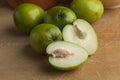 Fresh green whole and half Ambarella fruit