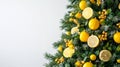 A fresh green and yellow Christmas tree with lemon-themed decorations Royalty Free Stock Photo