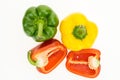 Fresh green, yellow and cut in two red bell peppers Royalty Free Stock Photo