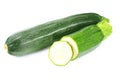 fresh green zucchini with slices isolated on white background Royalty Free Stock Photo