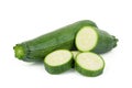 Fresh green zucchini with slices isolated on white Royalty Free Stock Photo