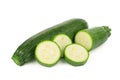 Fresh green zucchini with slices isolated on white Royalty Free Stock Photo