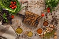 Fresh greens and tomatoes spices cereals and nuts organic healthy snacks on a textural background. Concept of healthy food. Royalty Free Stock Photo