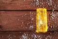 Fresh grilled corn cob with salt on wooden table Royalty Free Stock Photo