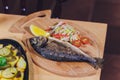 Fresh Grilled Dorado with Lemon and Cherry Tomatoes. Whole Bbq Sea Bream Fish Top View and Flat Lay. Sparus Aurata.