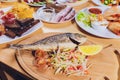 Fresh Grilled Dorado with Lemon and Cherry Tomatoes. Whole Bbq Sea Bream Fish Top View and Flat Lay. Sparus Aurata.