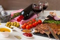 Fresh grilled meat. Grilled beef entrecote medium roast on black stone board, red wine and two full wine glasses. Royalty Free Stock Photo