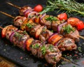 Fresh Grilled Skewers with Marinated Meat, Vegetables, Herbs on Slate Board, Barbecue Concept for Parties and Dinners Royalty Free Stock Photo