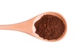 Ground coffee in a wooden spoon on a white background Royalty Free Stock Photo