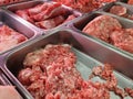 fresh ground pork on a stainless steel tray in supermarket