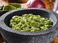 Fresh guacamole in stone molcajete Royalty Free Stock Photo