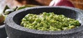 Fresh guacamole in stone molcajete Royalty Free Stock Photo