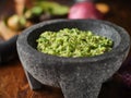 Fresh guacamole in stone molcajete Royalty Free Stock Photo