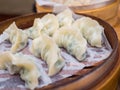 Fresh gyoza steamed Korean dumplings Mandu on bamboo steamer